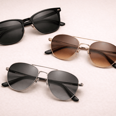 Men's glasses collection featuring stylish black, gold, and silver frames on a soft background.