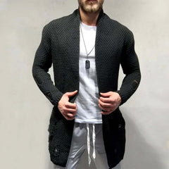 Stylish man wearing a long black knit cardigan, showcasing contemporary sweaters & knitwear for casual outings.