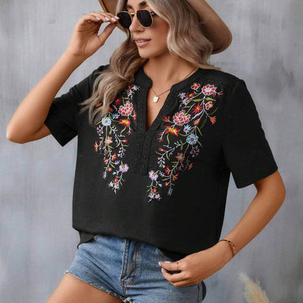 Fashion Flowers Embroidery Lace-collared Blouse worn by a woman with a hat and sunglasses, featured with floral embroidery details.