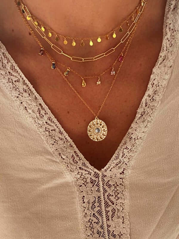 Geometric Disc Tassel Layered Necklace showing rhinestone details