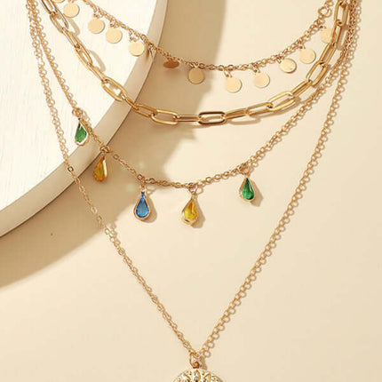 Geometric Disc Tassel Layered Necklace worn by model with black dress