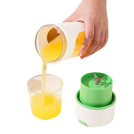 Kitchen Electric Juicer USB Charging Wireless Blender pouring fresh juice into a glass with a green blending base.