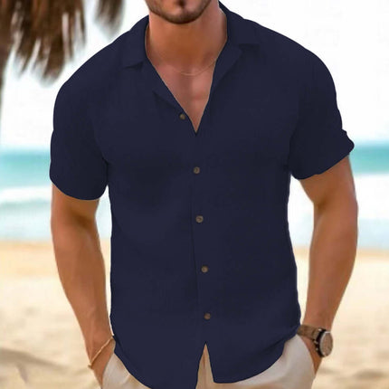 Men Short-Sleeved Button-Down Summer Shirt in navy blue, showcased on a model at the beach.
