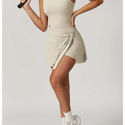 Sleeveless Sports Romper Yoga Jumpsuits worn by a model holding a paddle, showcasing a trendy activewear style.