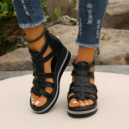 Summer Rhinestone Sandals With Back Zipper worn with ripped jeans, showcasing stylish black sandals with rhinestone details.