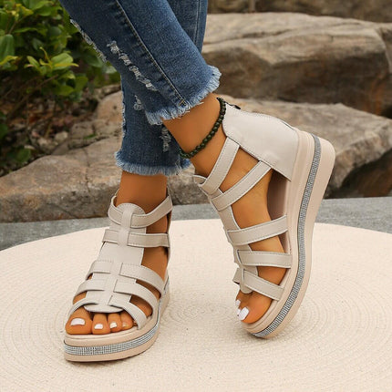 Summer Rhinestone Sandals With Back Zipper worn with blue jeans on a stone platform.