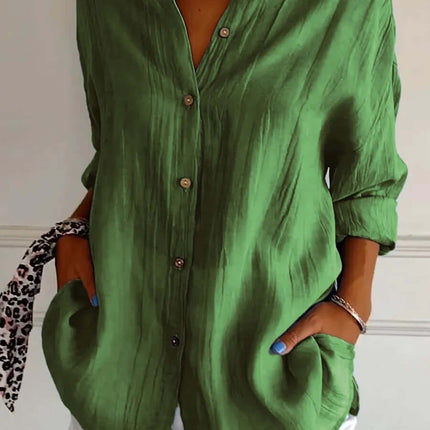 Womens Lapel Long Sleeve Single Breasted Pleated Shirt in green color, styled with white shorts and accessories.