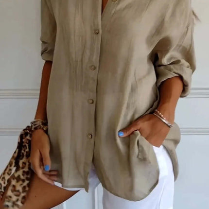 Womens Lapel Long Sleeve Single Breasted Pleated Shirt in beige, styled with white shorts and accessories.