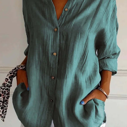 Womens Lapel Long Sleeve Single Breasted Pleated Shirt in teal, styled with white shorts and accessories.