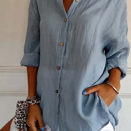 Womens Lapel Long Sleeve Single Breasted Pleated Shirt in light blue color with rolled sleeves and buttons.