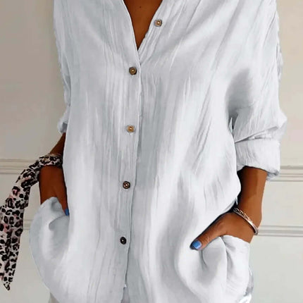 Womens Lapel Long Sleeve Single Breasted Pleated Shirt in white with buttons and pockets, styled casually.
