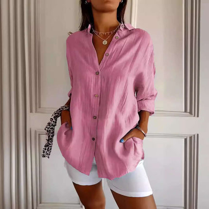 Womens Lapel Long Sleeve Single Breasted Pleated Shirt in pink, featuring buttons and pockets, styled with shorts.