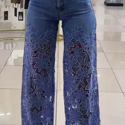 Y2K Lace Flowers Hollow High Waist Wide Leg Jeans showcased on a model with a white top in a stylish retail setting.