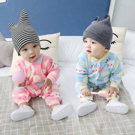 Baby Long Sleeve Romper featuring two toddlers in colorful onesies and hats, sitting comfortably on a bed.