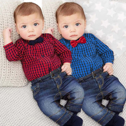 Two babies wearing Boy Gentleman Plaid One Piece Suit Pants Set, one in red plaid and one in blue plaid, sitting on a cozy blanket.