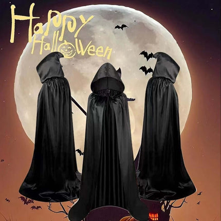 Children Halloween Wizard Hooded Satin Cloak Cape displayed against a full moon backdrop with Halloween decorations.