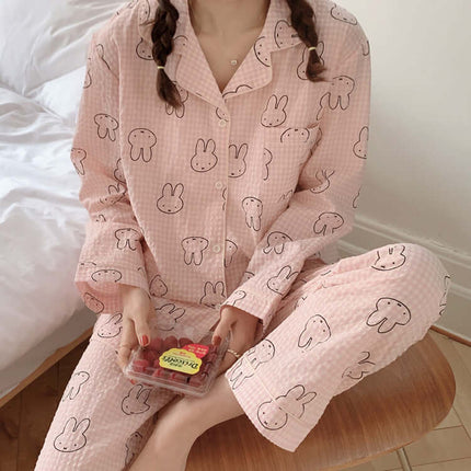 Cute Rabbit Pajamas For Women Sweet Cardigan Suit worn by a woman holding strawberries.