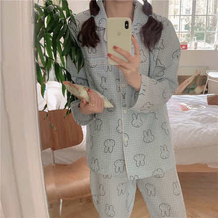 Cute Rabbit Pajamas For Women Sweet Cardigan Suit worn by a person in a cozy indoor setting, holding a magazine.