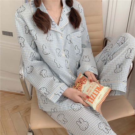 Cute Rabbit Pajamas For Women Sweet Cardigan Suit model wearing pajama set holding snacks, sitting on a chair.
