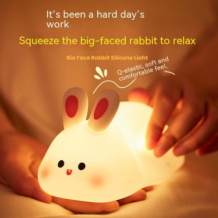 Cute Rabbit LED Night Light Soft Silicone Touch Lamp being squeezed for relaxation and comfort.