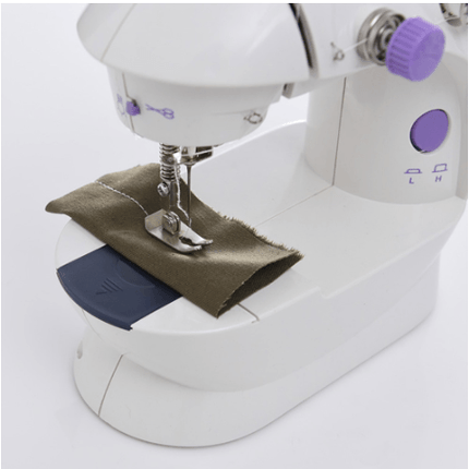 Electric Mini Household Multifunctional Sewing Machine sewing fabric with a needle and presser foot.