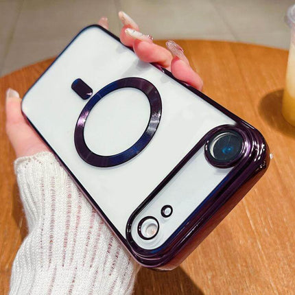 Electroplating MagSafe Phone Case for iPhone held in hand on wooden surface.