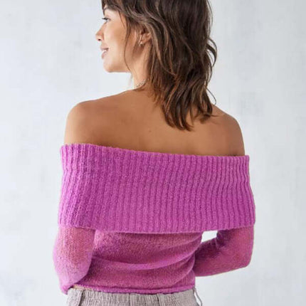 Woman wearing off shoulder long sleeve knit top slim stretch in vibrant pink, showcasing a stylish back view.