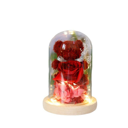 Eternal Rose Bear in Glass Dome home decor on a bedside table.