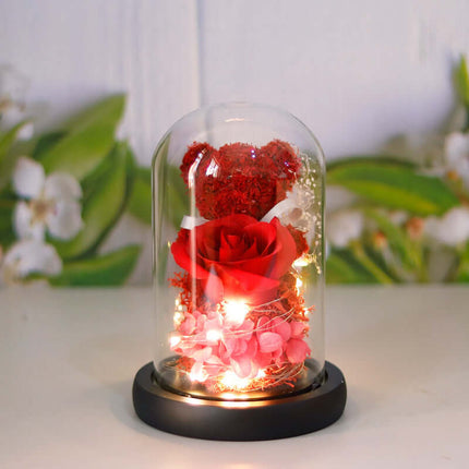 Eternal Rose Bear in Glass Dome warm yellow light effect.