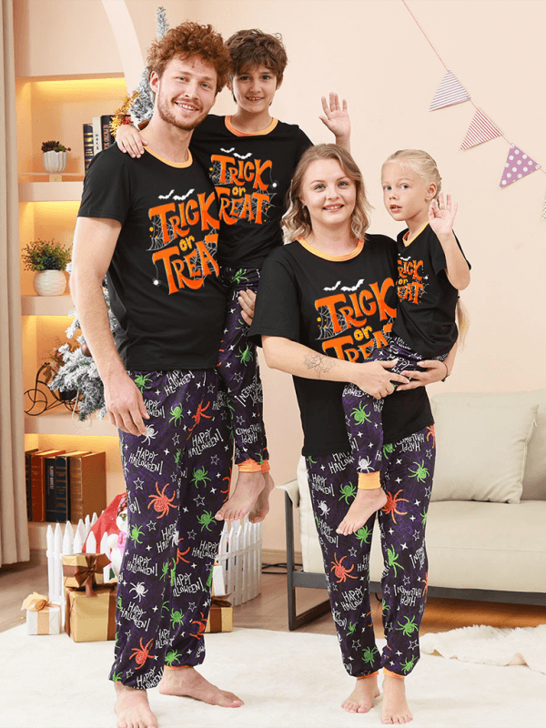 Family Matching Holiday Pajamas – Spider Printed Loungewear for Halloween and Christmas in a cozy living room.