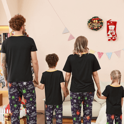 Family Matching Holiday Pajamas – Spider Printed Loungewear for Halloween and Christmas worn by a family together.