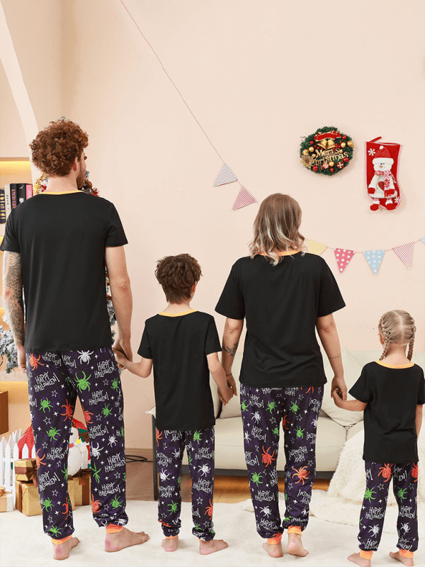 Family Matching Holiday Pajamas – Spider Printed Loungewear for Halloween and Christmas worn by a family together.