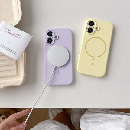 Fine Circle Magnetic Liquid Silicone Phone Case in lavender and yellow with magnetic charger on a white table.