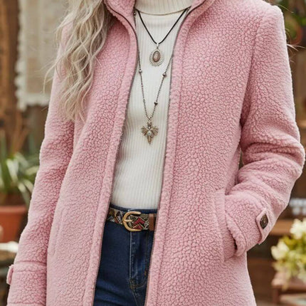 Fleece Zip-Up Jacket Women's Stand Collar Loose Outerwear in pink worn over a white sweater, styled with jewelry and a belt.