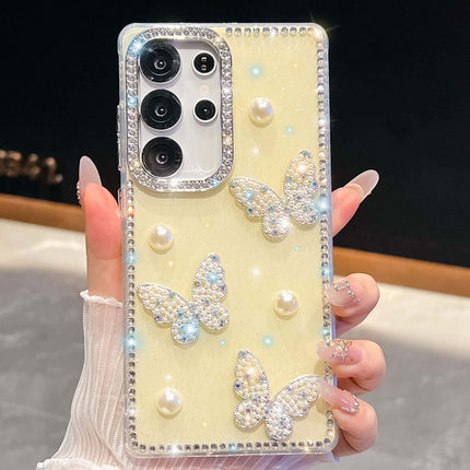 Glitter Powder Pearl Butterfly Rhinestone Phone Case with multiple rhinestone butterflies and pearl accents on a sparkly background.