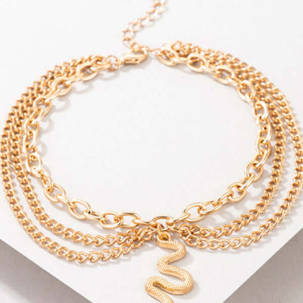 Gold Heart Snake Charm Tassel Layered Anklet Set for Women charm closeup