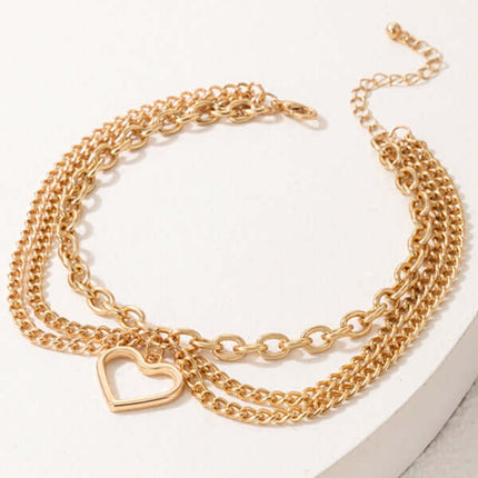 Gold Heart Snake Charm Tassel Layered Anklet Set for Women macro shot