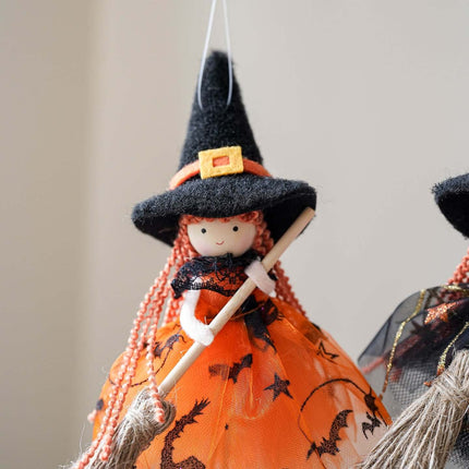 Halloween Mesh Broom Witch Angel Hanging Pendant Decor with a witch figure in an orange dress and black hat. Perfect for Halloween decor.