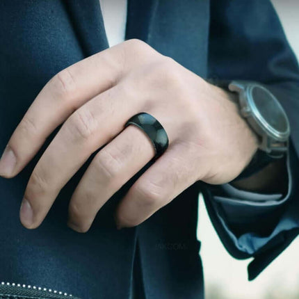 JAKCOM R4 Smart Ring Multifunctional Wearable on a hand, showcasing its sleek design and modern style.
