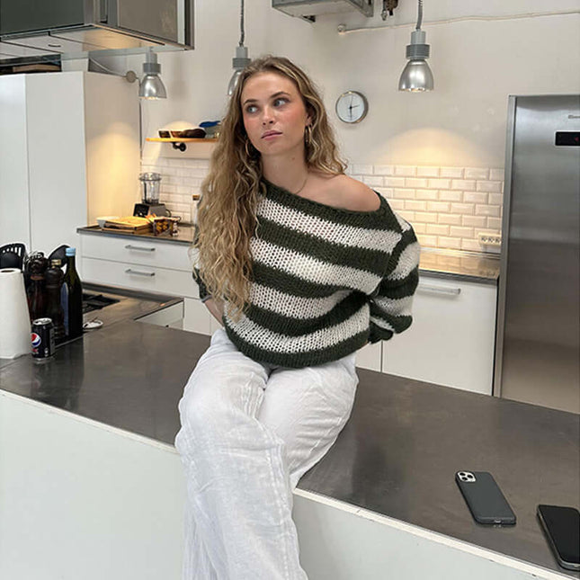 Loose Striped Pullover Sweater polyester fabric texture.