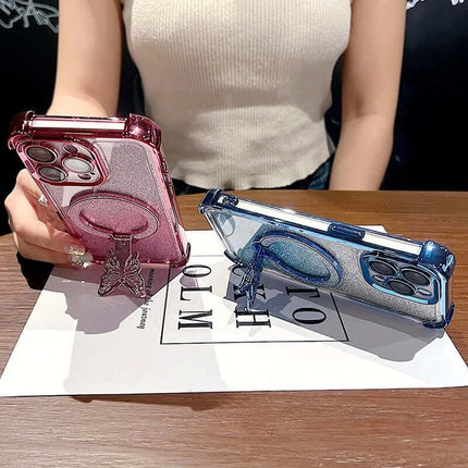 Two Magnetic Bowknot Stand Electroplated S25 Ultra Cases displayed on a table, one pink and the other blue, showcasing their designs.