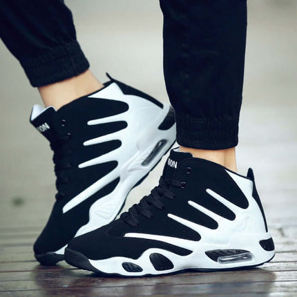 Men Air Cushion Wear-Resistant Basketball Sneakers in black and white on a wooden floor.