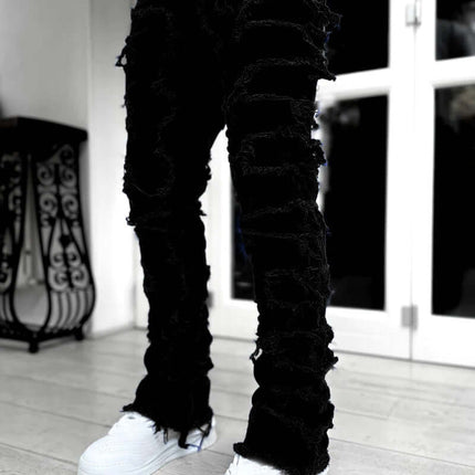 Men Ripped Stacked Slim Fit Jeans Streetwear with ripped details, styled for a modern urban look.
