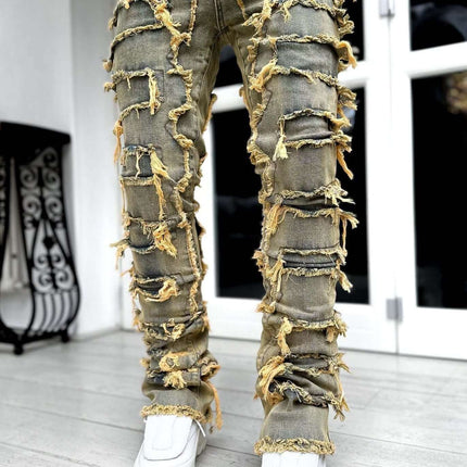 Men Ripped Stacked Slim Fit Jeans Streetwear featuring ripped details and stacked leg styling, paired with stylish sneakers.