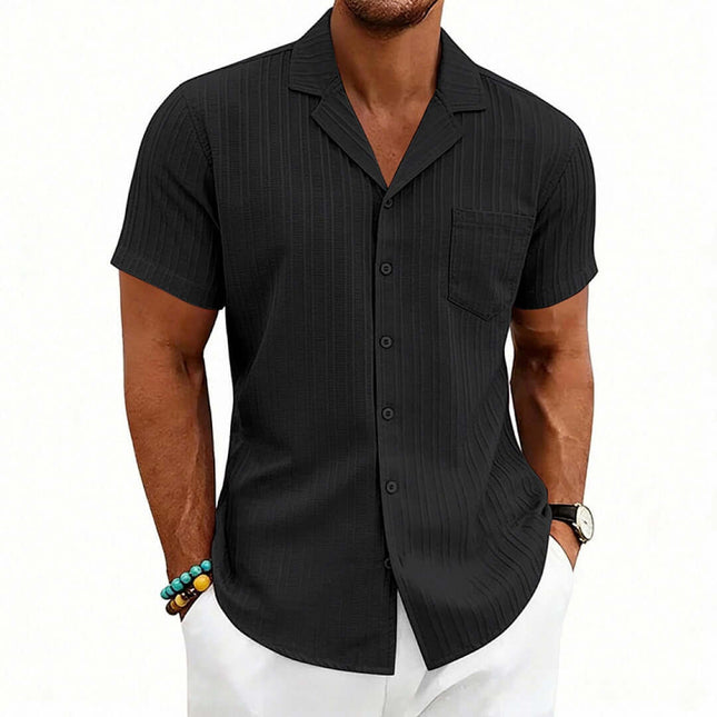 Men's Casual Cuban Neck Short Sleeve Shirt in black with a pocket and striped design, worn by a model.