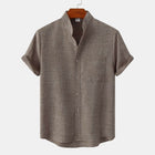 Men's Luxury Casual Button Up Shirt in a soft brown fabric with short sleeves and a chest pocket.