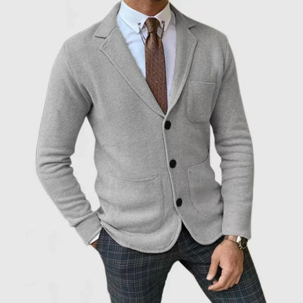 Men's Slim-Fitting English Style Casual Formal Suit Coat worn by a model, featuring a grey blazer with a pocket and stylish detailing.