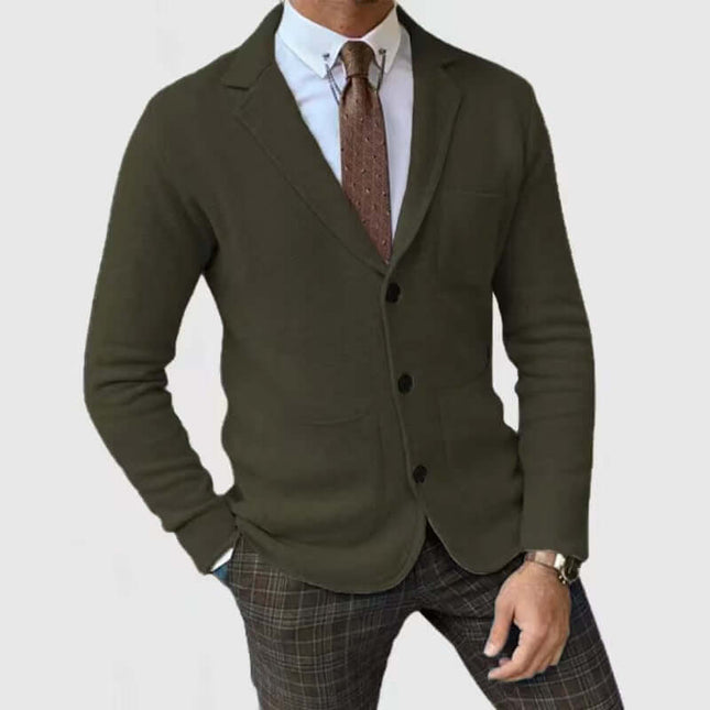 Men's Slim-Fitting English Style Casual Formal Suit Coat in dark green worn with a white shirt and patterned pants.