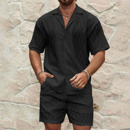 Mens Summer Casual Button Shirt And Shorts Set in black fabric with a stylish design on a model against a textured wall.
