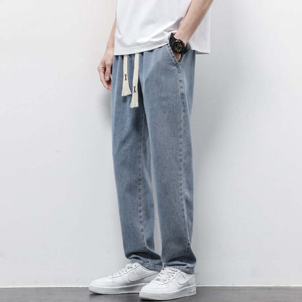 Men's Summer Loose Wide Leg Drawstring Jeans worn by a skater model for an authentic streetwear high street aesthetic